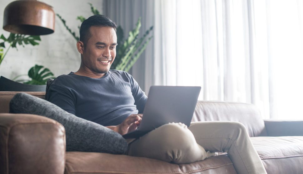 Asian-man-looking-at-the-computer-at-home