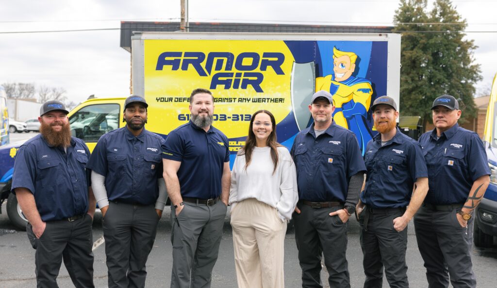 Armor Air team members lined up for photo in front of company truck