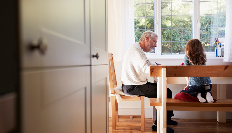 Grandfather-And-Granddaughter-Colouring-Picture-Together